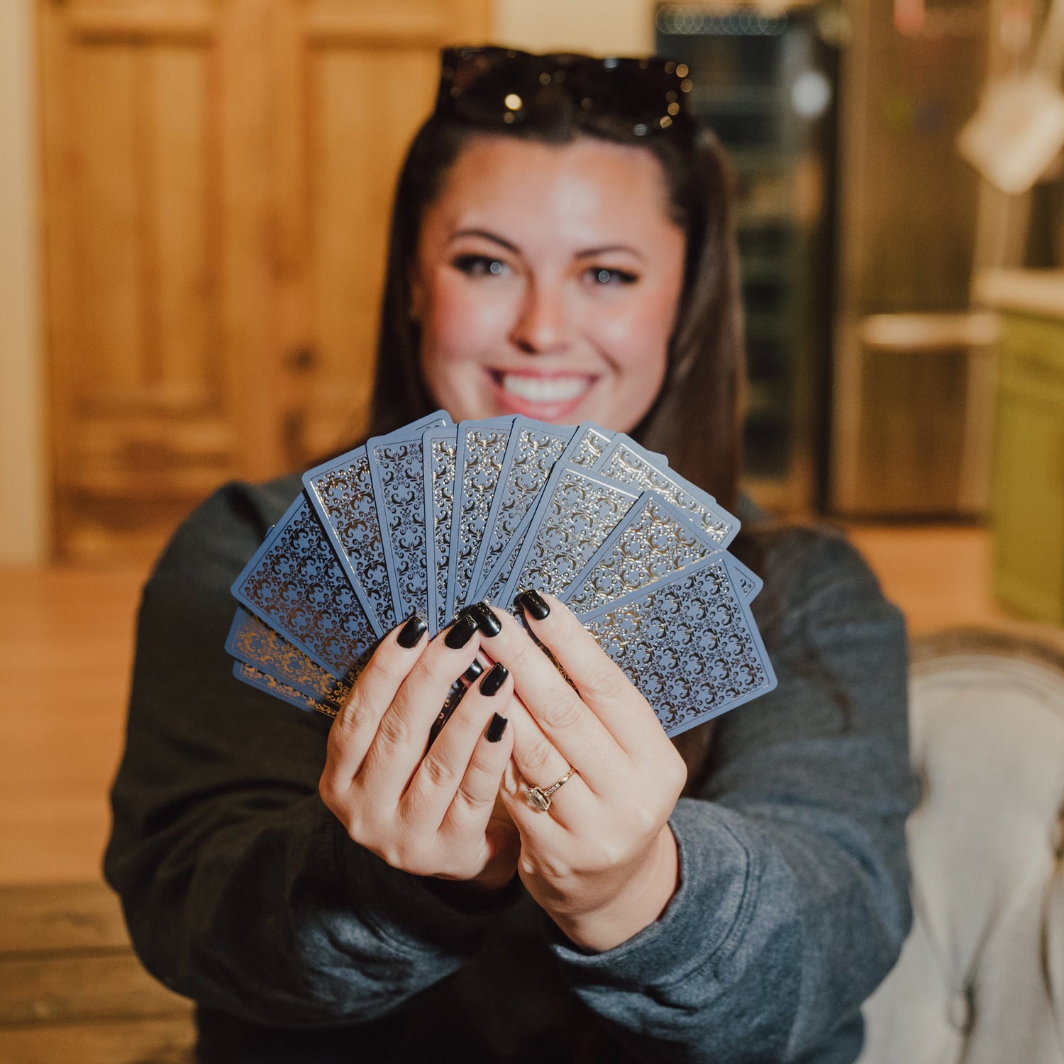 Katie holding cards back