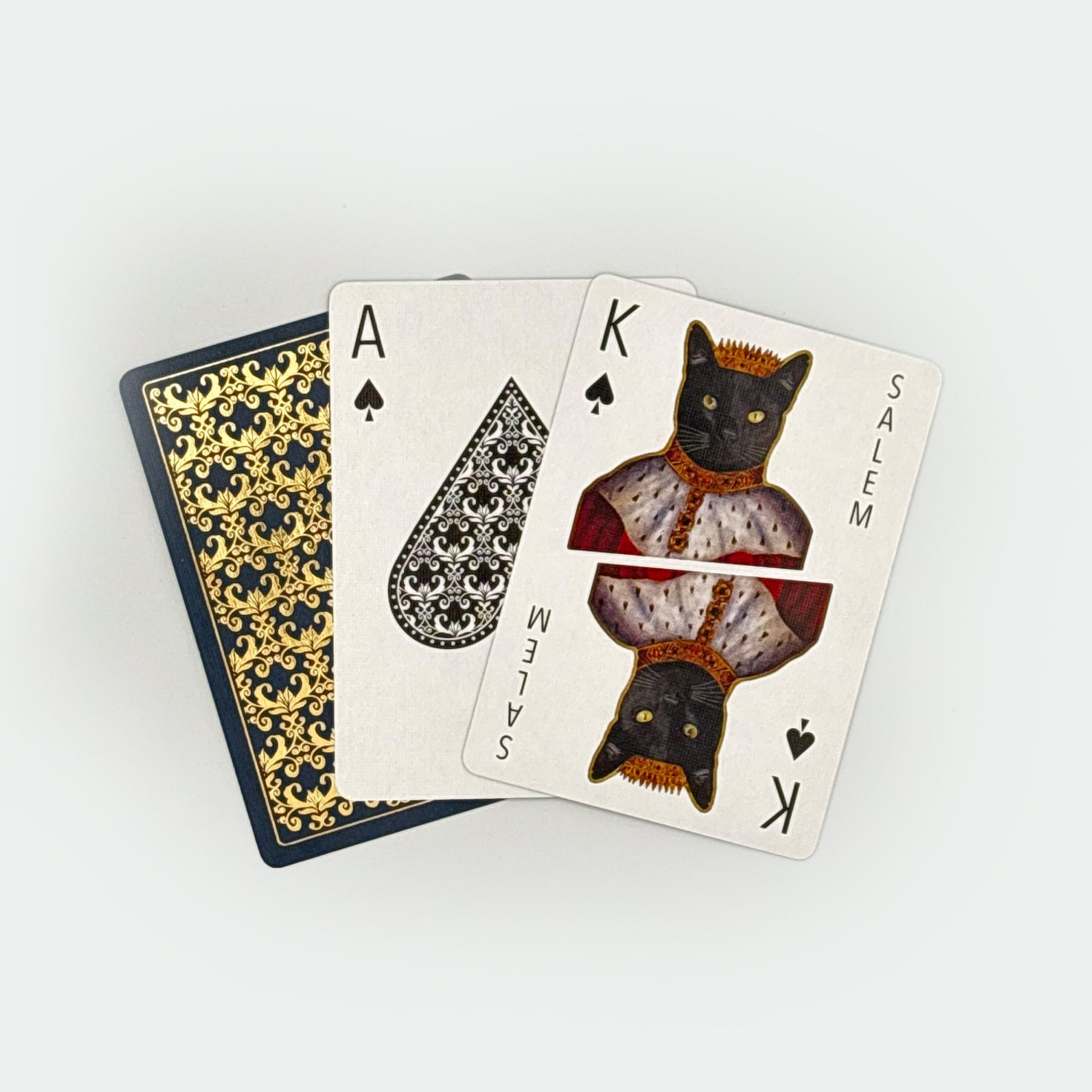 Playing cards with black cat design on a white background